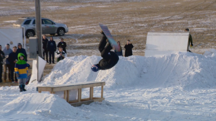 Mark McMorris and his brother Craig do flips and jumps with Saskatoon kids as the brothers throw their support behind the Optimist Hill project at Diefenbaker Park.