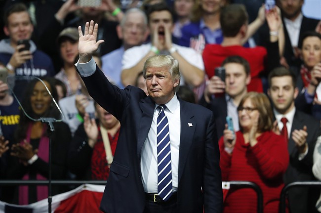 President-elect Donald Trump waves to supporters during a rally in Grand Rapids, Mich., Friday, Dec. 9, 2016.