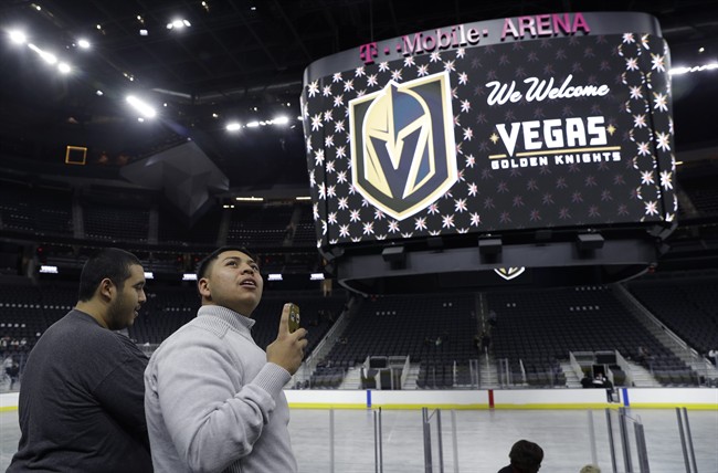 FILE - In this Nov. 22, 2016, file photo, people tour T-Mobile Arena during an event to unveil the name of Las Vegas' National Hockey League franchise, in Las Vegas.