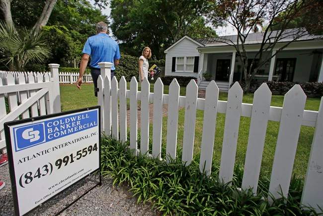 Real estate agent Lauren Newman, right, prepares to show Steve Martin a home for sale in Mount Pleasant, S.C., just over the bridge from historic Charleston. 