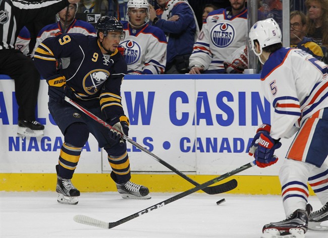 Buffalo Sabres forward Evander Kane (9) carries the puck into the zone during the first period of an NHL hockey game against the Edmonton Oilers, Tuesday, Dec. 6, 2016, in Buffalo, N.Y. 