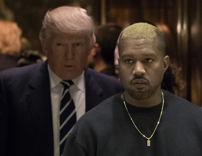 Kanye West and President-elect Donald Trump arrive to the lobby of Trump Tower in New York, Tuesday, Dec. 13, 2016.
