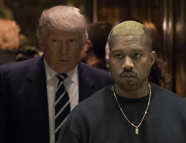 Kanye West and President-elect Donald Trump arrive to the lobby of Trump Tower in New York, Tuesday, Dec. 13, 2016. 