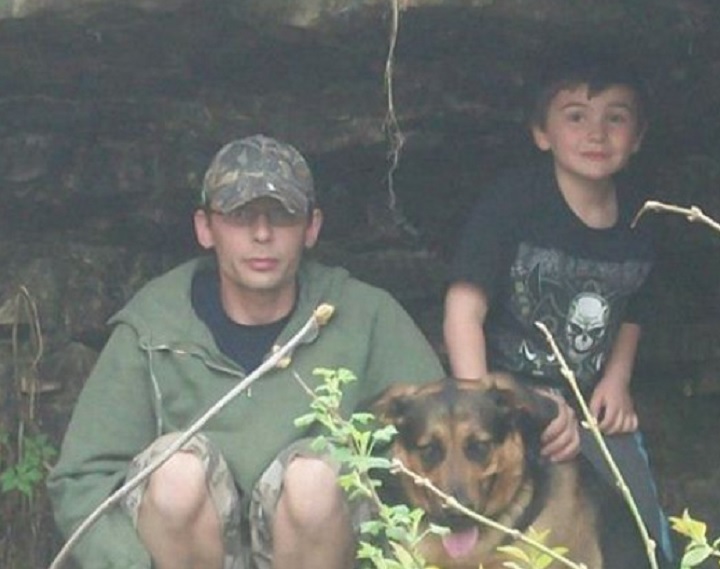 Mike King (left) and family dog Bud (centre) pictured in a photograph.