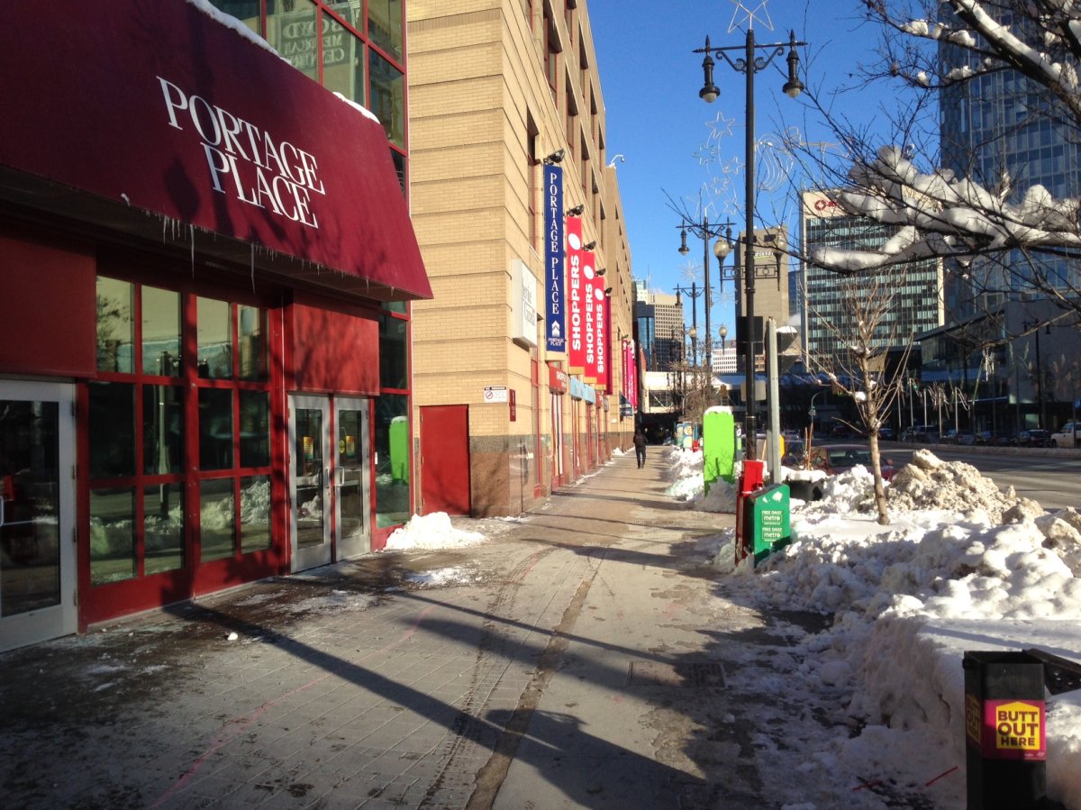 Police arrested a man causing a disturbance behind Portage Place Sunday morning.