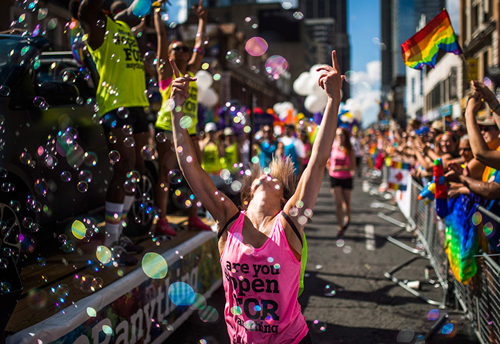 A woman dances during the Toronto Pride Parade on July 3, 2016.