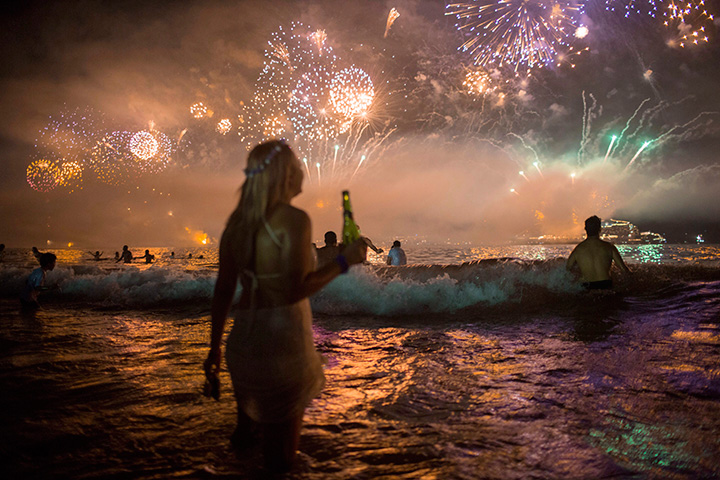 Fireworks light the sky over Copacabana beach during New Year’s Eve celebrations in Rio de Janeiro, Brazil, on Jan. 1, 2016.