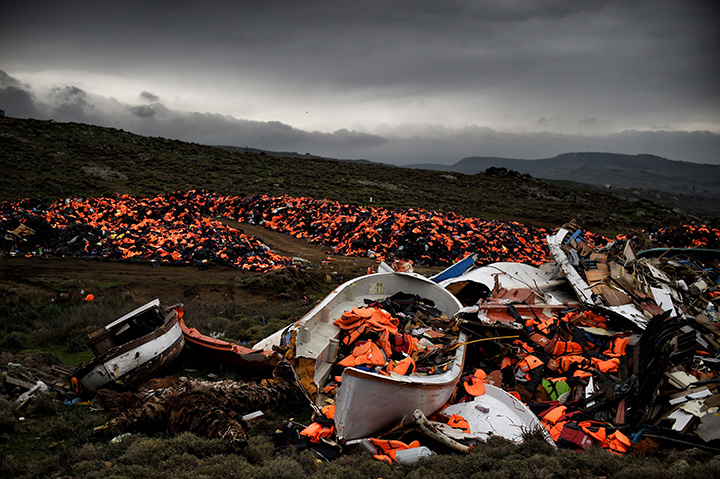 Wrecked boats and thousands of life jackets, used by refugees and migrants during their journey across the Aegean Sea, lie in a dump in Mithimna, Greece on February 19, 2016.