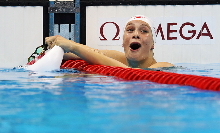 Canada’s Penny Oleksiak celebrates winning silver in the women’s 100-metre butterfly final during Day 2 of the Rio 2016 Olympic Games on Aug. 7, 2016.