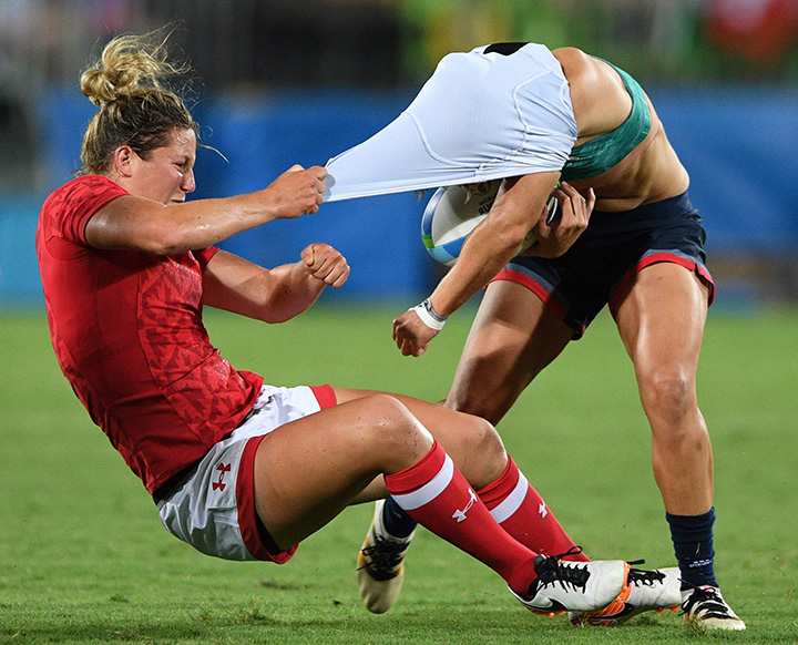 Canada’s Kelly Russell rips the shirt off of Great Britain’s Katy McLean as she tackles her during the bronze medal match in women’s rugby sevens at the 2016 Olympic Summer Games in Rio de Janeiro, Brazil on Aug. 8, 2016.