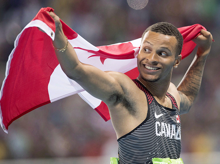 Canada's Andre De Grasse celebrates bronze in the men's 100-metre final during the athletics competition at the 2016 Olympic Summer Games in Rio de Janeiro, Brazil on Sunday, August 14, 2016. 