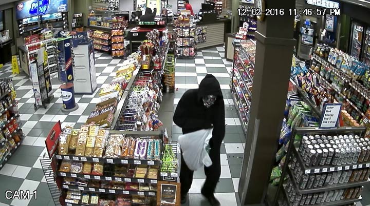 Saskatoon police have released a surveillance photo of two masked suspects during an armed robbery at a convenience store on Friday night.