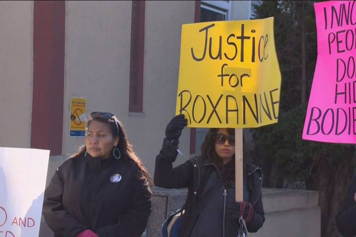A file photo of people holding signs outside of court during Grace Robotti's trial.