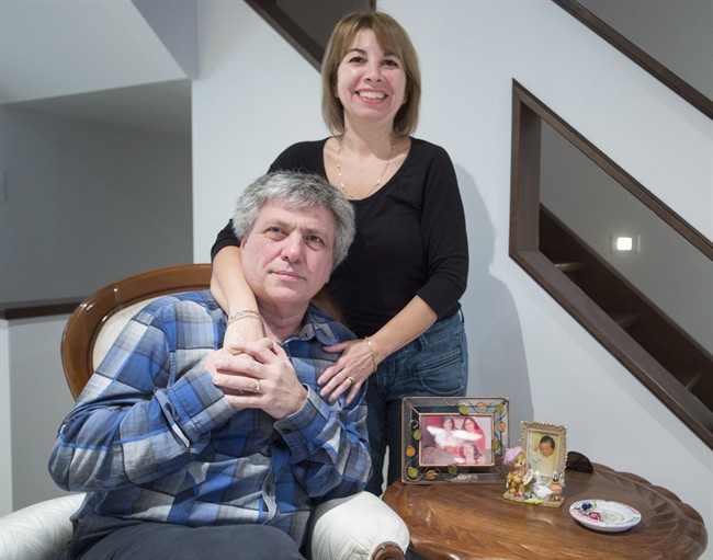 Frank Poccia and his wife, Paola Fusco are seen in there home Tuesday, November 29, 2016 in Montreal. When he was driven deep into the Libyan desert and told to kneel in the sand, Frank Poccia thought his seven weeks as a hostage were drawing to a tragic close.