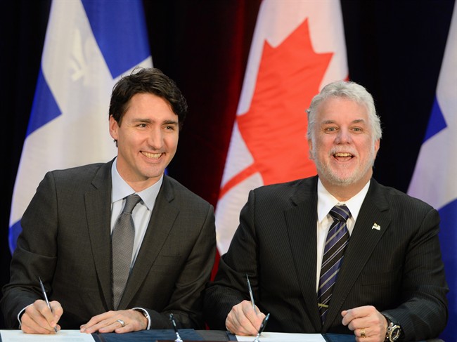 Prime Minister Justin Trudeau and the Premier of Québec Philippe Couillard sign an infrastructure agreement in Montreal.
