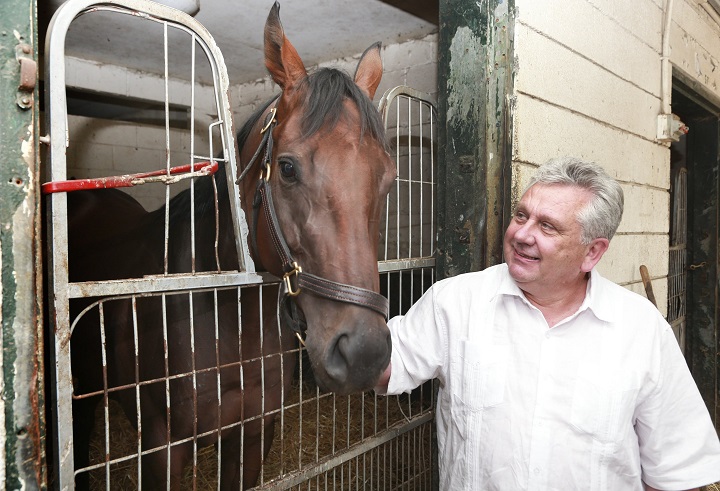 John Simmonds, chairman and CEO of A.C. Simmonds and Son Inc., is seen at the Woodbine racetrack stables in Toronto on Aug. 8, 2014.