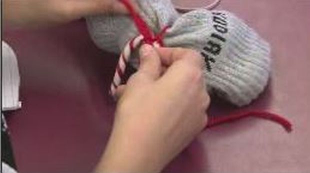 Students at Sunalta School stuff socks to help homeless people in Calgary.
