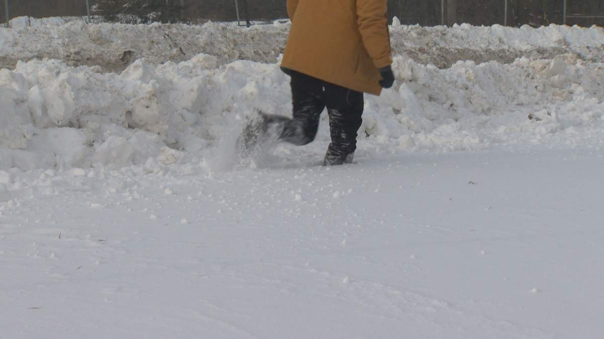 The deep snow along Archibald Street sidewalks left behind by blizzard.