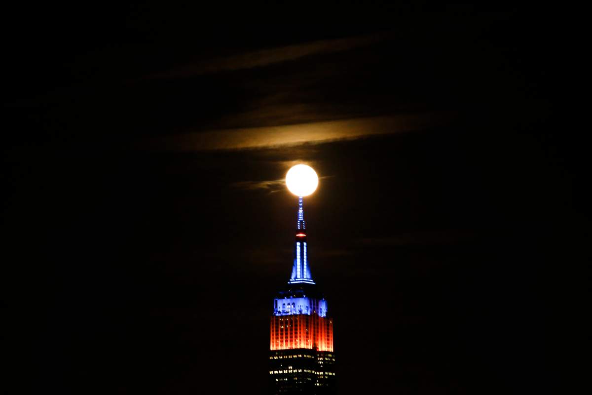 HOBOKEN, NJ – OCTOBER 16: A full Hunter’s super moon rises behind middle Manhattan and Empire State Building in New York City on October 16, 2016 as seen from Hoboken, NJ, (Photo by VIEWpress/Corbis via Getty Images)