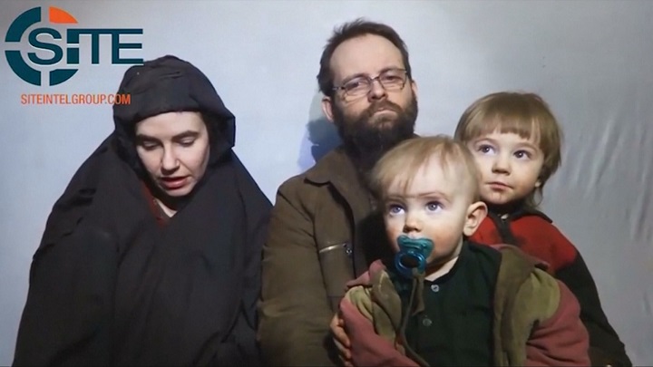 This undated image from a Taliban video posted on YouTube in December 2016, shows Canadian Joshua Boyle and American Caitlan Coleman, who were kidnapped in Afghanistan in 2012, with their two children.