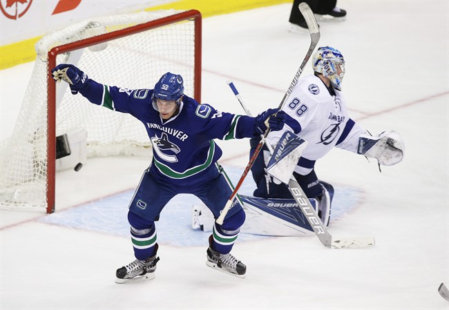 Vancouver Canuck Bo Horvat (53) celebrates his goal against Tampa Bay Lightning goaltender Andrei Vasilevskiy (88) during third period NHL hockey action against the Vancouver Canucks, in Vancouver on Friday, Dec. 16, 2016. 