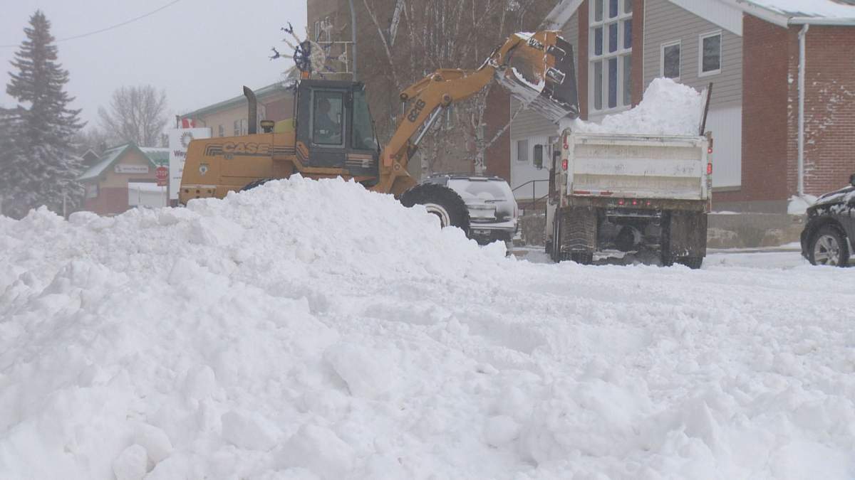 Crews work to clear snow in downtown Weyburn.