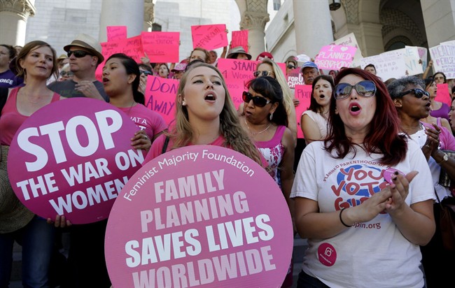 Planned Parenthood supporters rally for women's access to reproductive health care on "National Pink Out Day'' at Los Angeles City Hall.