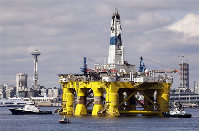 FILE - In this May 14, 2015, file photo, the oil drilling rig Polar Pioneer is towed toward a dock in Elliott Bay in Seattle. 