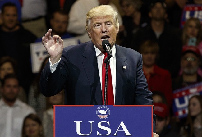 FILE - In this Dec. 1, 2016, photo, President-elect Donald Trump gestures as he speaks during a "USA Thank You" tour event in Cincinnati. Russia‚Äôs government staunchly denies reports that it tampered in the U.S. election or supported either candidate, but once the results were in, members of President Vladimir Putin‚Äôs United Russia party didn‚Äôt hold back. (AP Photo/Evan Vucci).