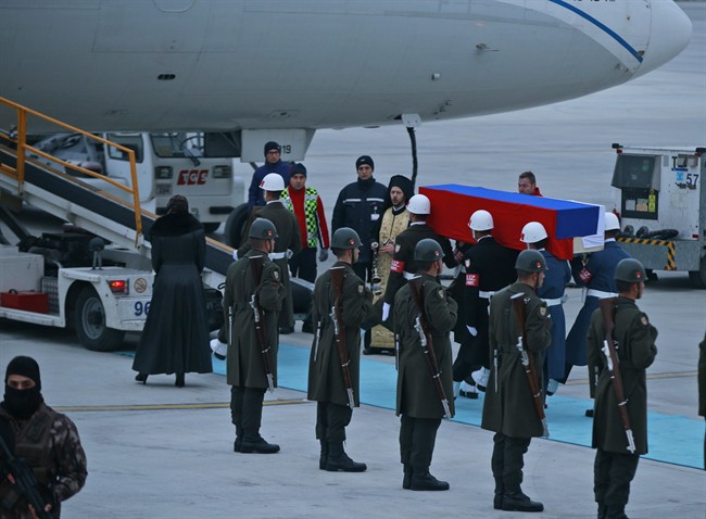 Members of a Turkish forces honour guard carry the Russian flag-draped coffin of Russian Ambassador to Turkey Andrei Karlov who was assassinated Monday, toward a plane to be carried home, during a ceremony at the airport in Ankara, Turkey, Tuesday, Dec, 20, 2016. Turkey and Russia are more committed than ever to advance peace efforts in Syria, the two countries' foreign ministers declared Tuesday, a day after the killing in an attack both countries described as an attempt to disrupt their improved ties. (AP Photo/Emrah Gurel).