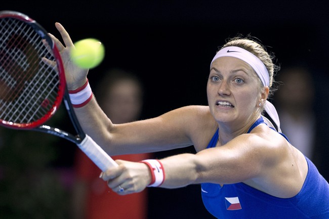  In this Nov. 12, 2016 file picture Czech Republic's Petra Kvitova returns the ball to France's Caroline Garcia during the Fed Cup final in Strasbourg, eastern France. (AP Photo/Jean-Francois Badias,file).