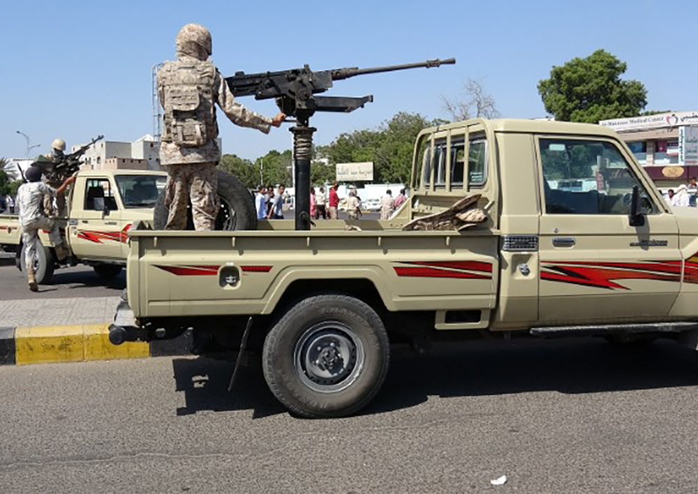 Army patrols are seen on a street near the site of a suicide bombing in the southern port city of Aden, Yemen December 18, 2016. 