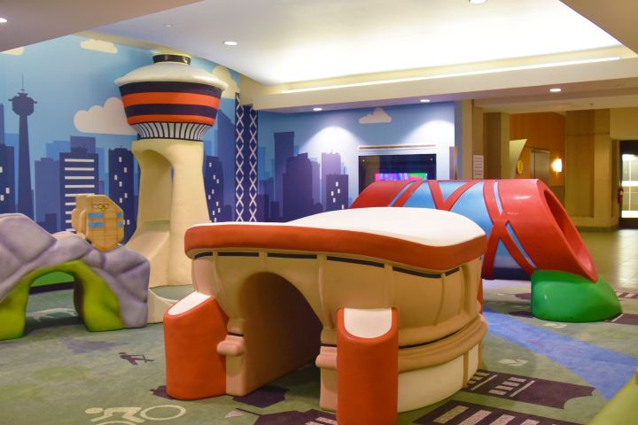The play zones at the Calgary airport have special foam floor for kids.