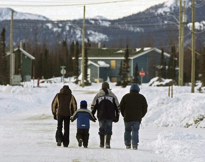 In this file photo, residents walk in the northern Labrador community of Natuashish, N.L. on Thursday, Dec. 6, 2007.   A Quebec coroner's report says five suicides that occurred in two
indigenous communities in 2015 on Quebec's North Shore were avoidable. Saturday, Jan. 14, 2017.
 