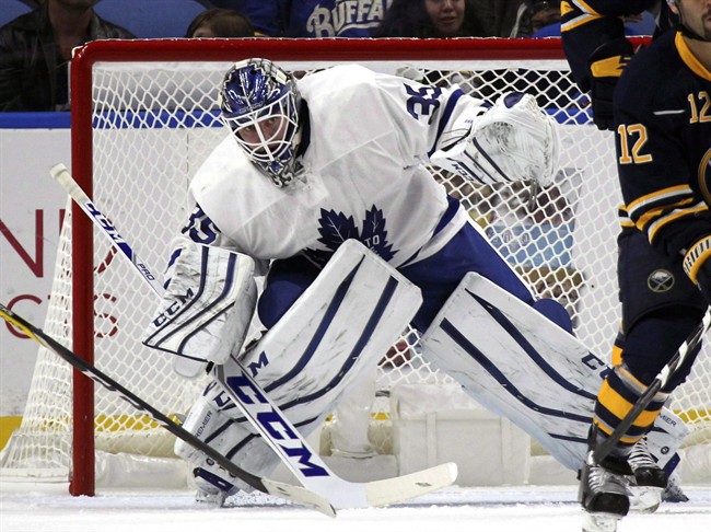 Toronto Maple Leafs goalie Jhonas Enroth (35) is screened during the first period of a preseason NHL hockey game against the Buffalo Sabres, Friday, Sept. 30, 2016, in Buffalo, New York. 