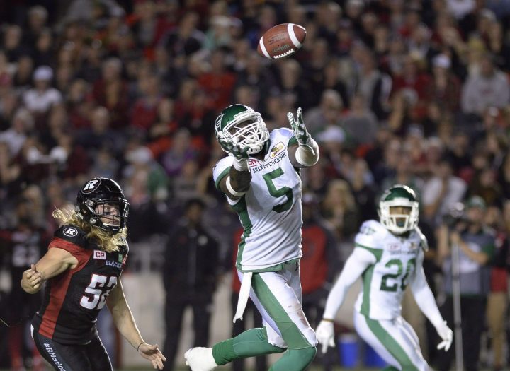 Saskatchewan Roughriders' Willie Jefferson (5) reaches for the ball, thrown by Ottawa Redblacks quarterback Trevor Harris ( not shown), as teammate Otha Foster III (20) and Redblacks' Tanner Doll (52) look on during second half CFL action on Friday, Oct. 7, 2016 in Ottawa.