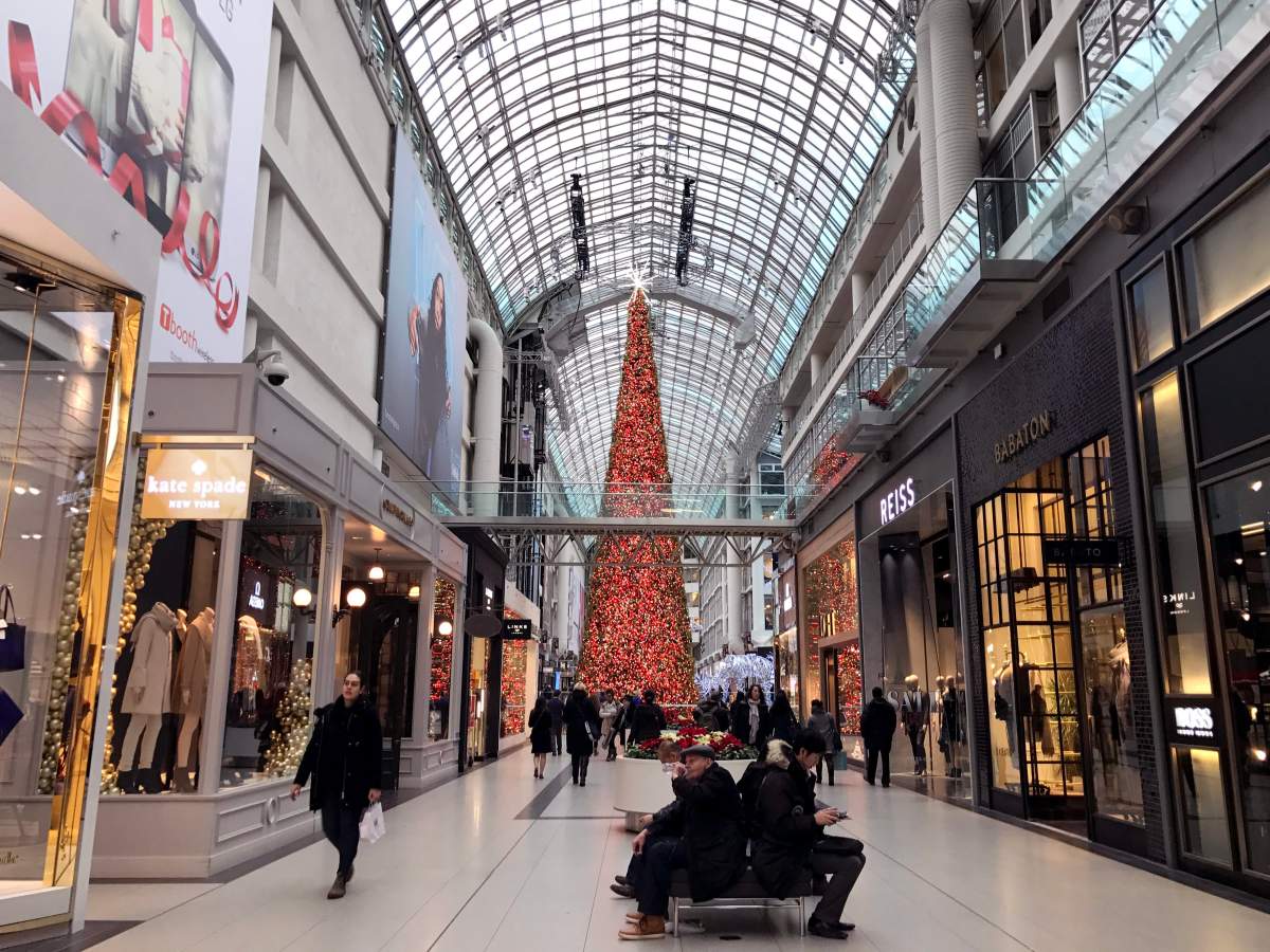 People shop at CF Toronto Eaton Centre a few days before Christmas, Toronto Ont., Dec. 22, 2016.