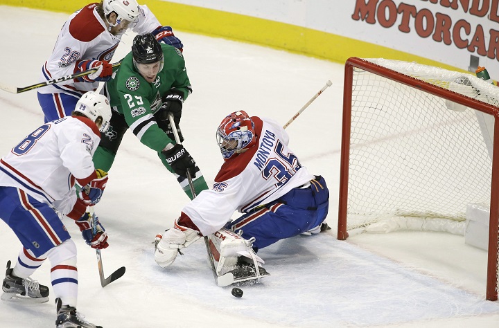 Montreal Canadiens goalie Al Montoya (35) defends the goal with teammates Jeff Petry (26) and Nathan Beaulieu (28) against Dallas Stars right wing Brett Ritchie (25) during the second period of an NHL hockey game in Dallas, Wednesday, Jan. 4, 2017. (AP Photo/LM Otero)