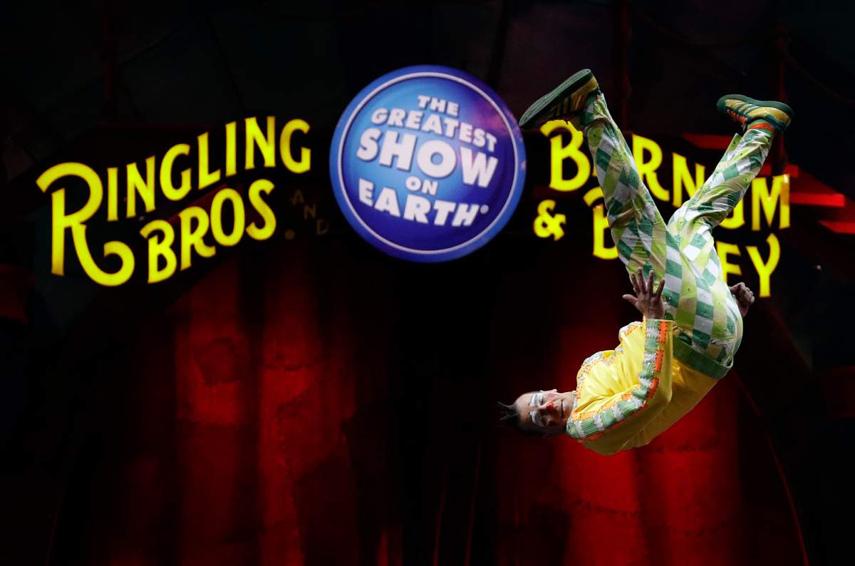 A Ringling Bros. and Barnum & Bailey clown does a somersault during a performance Saturday, Jan. 14, 2017, in Orlando, Fla.