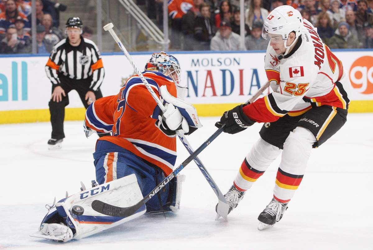 Calgary Flames' Sean Monahan (23) is stopped by Edmonton Oilers' goalie Cam Talbot (33) in the shootout during NHL action in Edmonton, Alta., on Saturday January 14, 2017.