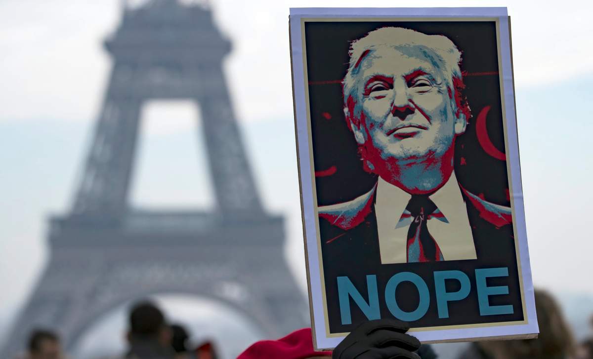 Protesters march near the Eiffel Tower during the Women’s March in Paris, France on Jan. 21, 2017. EPA/IAN LANGSDON