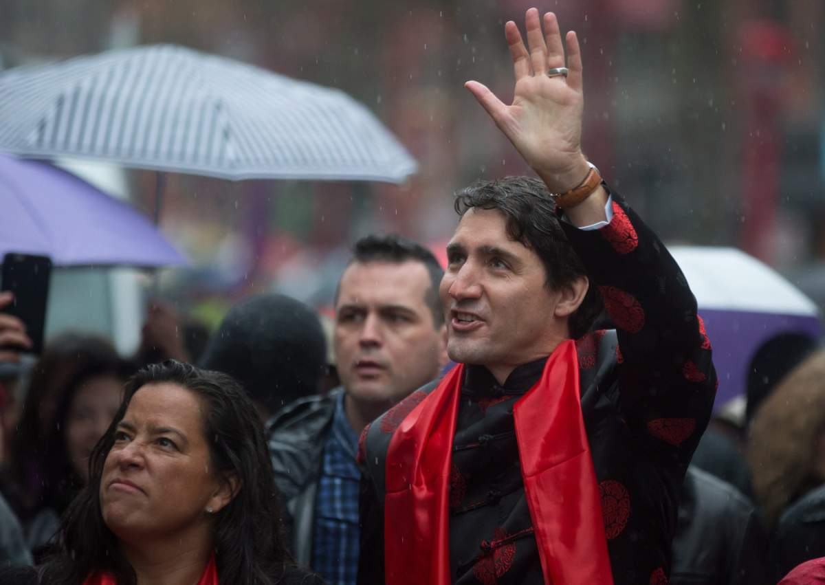 Prime Minister Justin Trudeau, right, and Justice Minister Jody Wilson-Raybould walk in the Chinese Lunar New Year parade in Vancouver, B.C., on Sunday, January 29, 2017. THE CANADIAN PRESS/Darryl Dyck.