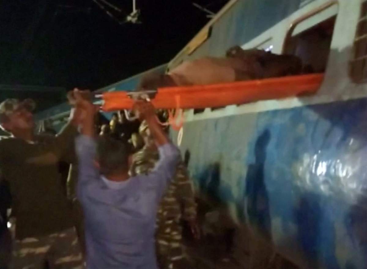 Rescuers lifted an injured passenger out of a Hirakhand express train from Jagdalpur to Bhubaneswar after coaches of the passenger train derailed near Kuneri station, in the state of Andhra Pradesh, outside the town of Rayagada, India, in this still image from video January 22, 2017.