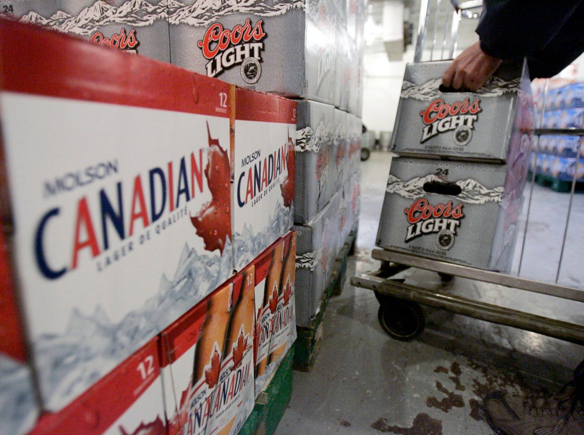 A Molson employee stacks cases of Coors Light at the Molson brewery retail store in Toronto, January 18, 2005.  THE CANADIAN PRESS/J.P. Moczulski.