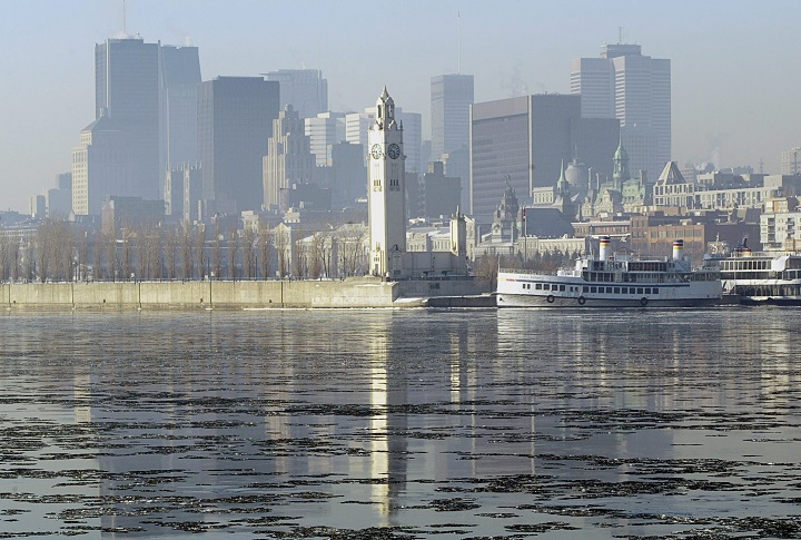 In this Feb. 2005 file photo, smog obscures the skyline of downtown Montreal. Environment Canada issued a smog warning for the Montreal area Monday, Nov. 13, 2017.