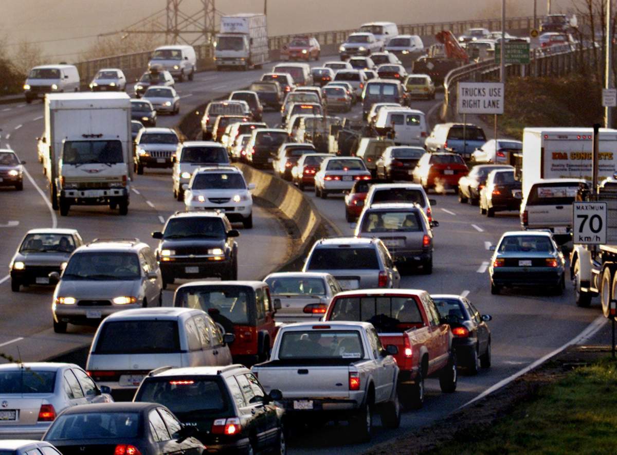 Vehicles slowly wind their way onto the Second Narrows Bridge from North Vancouver during early morning rush hour.