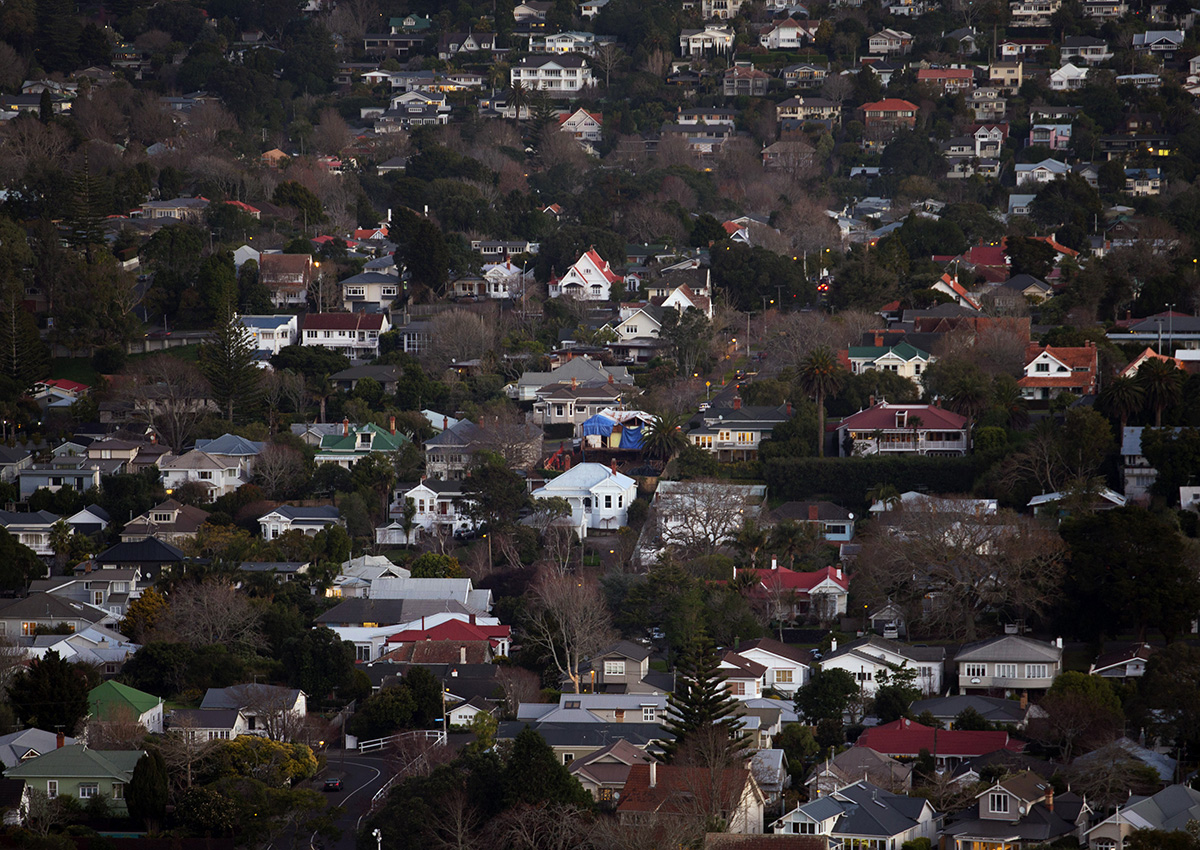 FILE: Houses stand in the suburbs of Auckland, New Zealand.