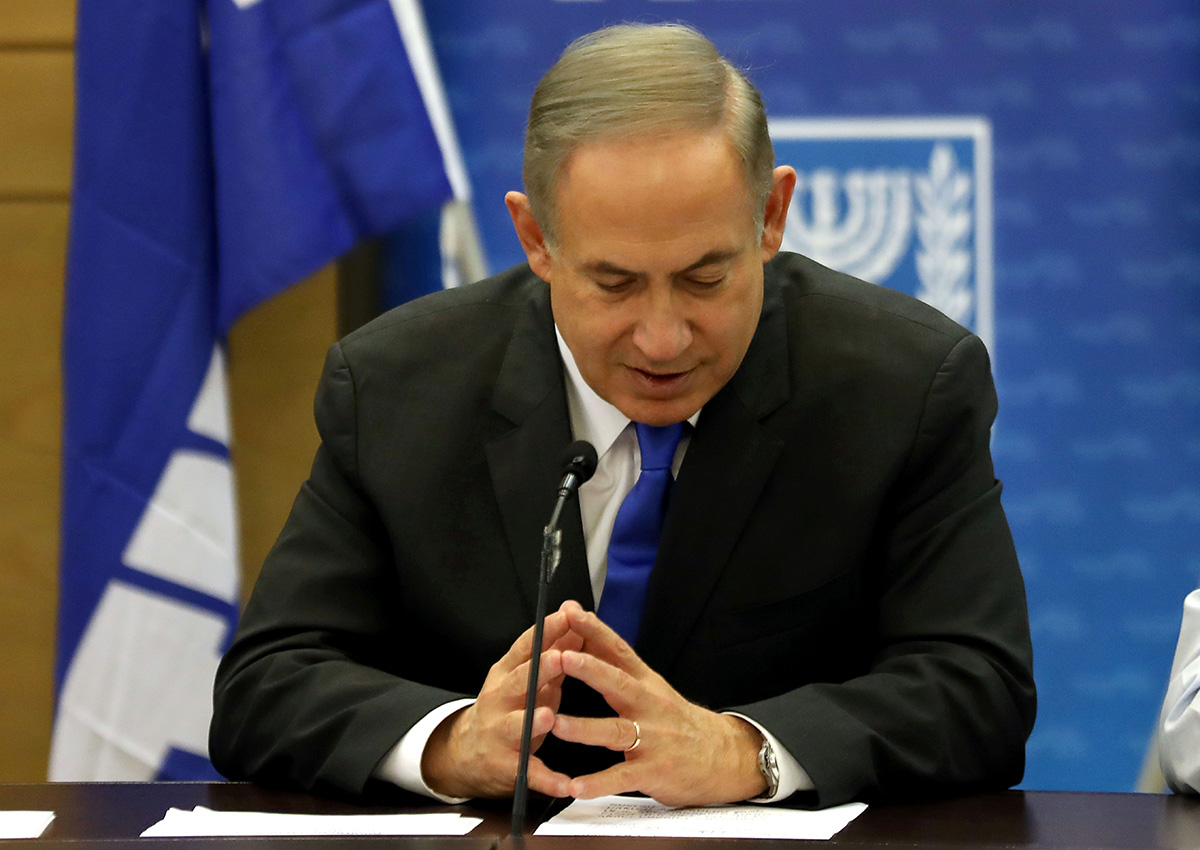 Israeli Prime Minister Benjamin Netanyahu gestures as he speaks during a Likud faction meeting at the Knesset (Israel's Parliament) in Jerusalem on  January 2, 2017.