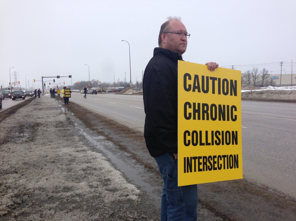 WiseUp Winnipeg members lined the intersection of St. Mary's road and Bishop Grandin Blvd warning drivers of dangerous intersection.