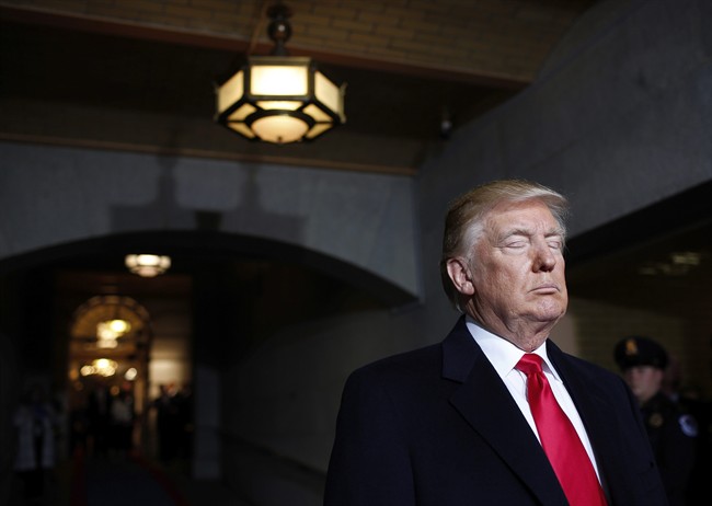 President-elect Donald Trump pauses as he waits to be introduced on the West Front of the U.S. Capitol on Friday, Jan. 20, 2017, in Washington, for his inauguration ceremony as the 45th president of the United States. (Win McNamee/Pool Photo via AP).